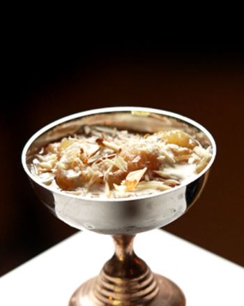 Bicyclist looking out over hill at ocean