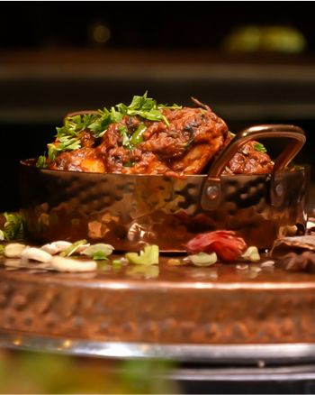 Bicyclist looking out over hill at ocean