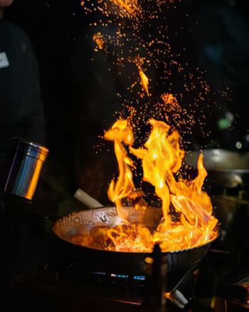 Bicyclist looking out over hill at ocean